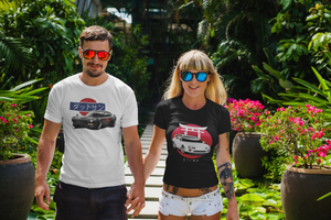 Man wearing a white Datsun 240Z t shirt and a woman wearing a black Toyota Supra t shirt