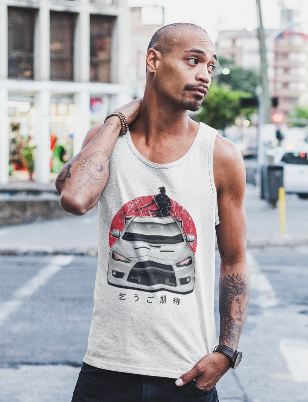 Man wearing a white Mitsubishi Evo tank top in car clothing - Modified Street Style